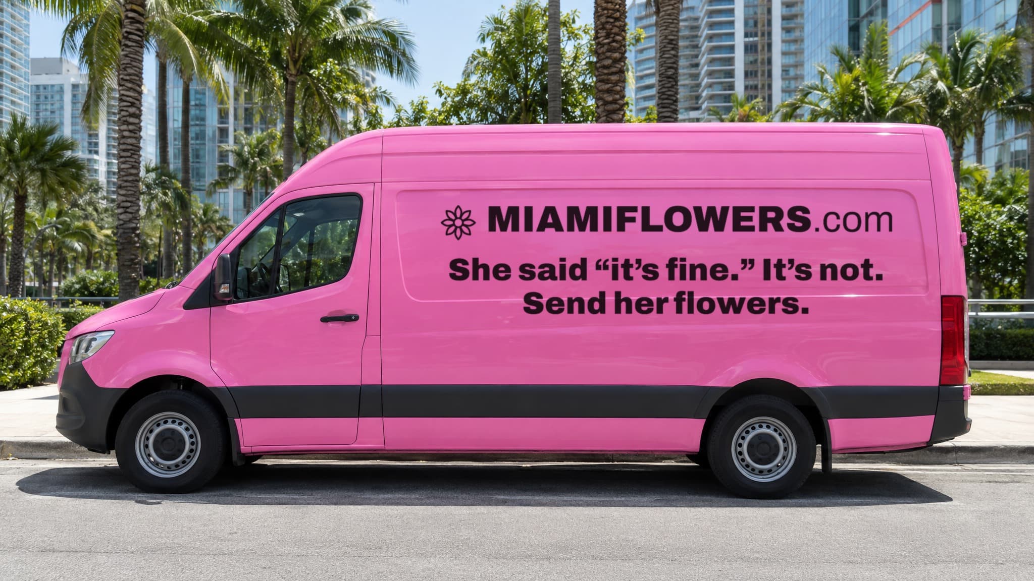 Pink MIAMIFLOWERS.com Sprinter van in Brickell reading 'She said it's fine. It's not. Send her flowers.'