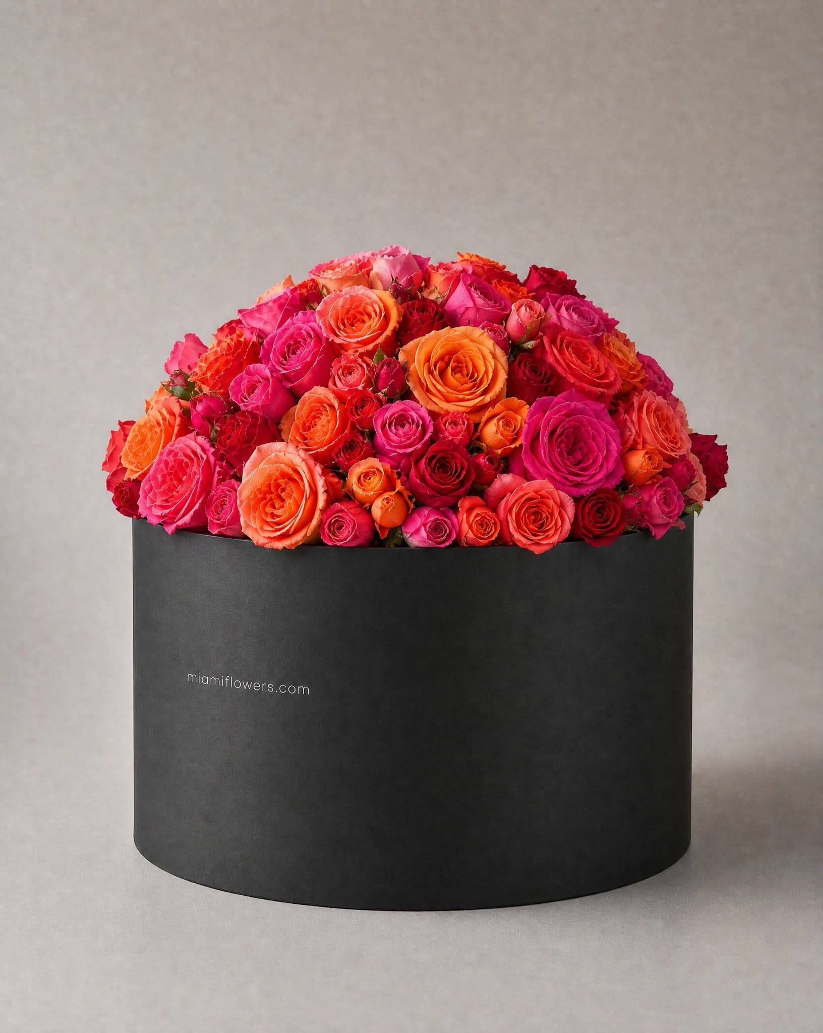 Roses in an oval box printed with miamiflowers.com